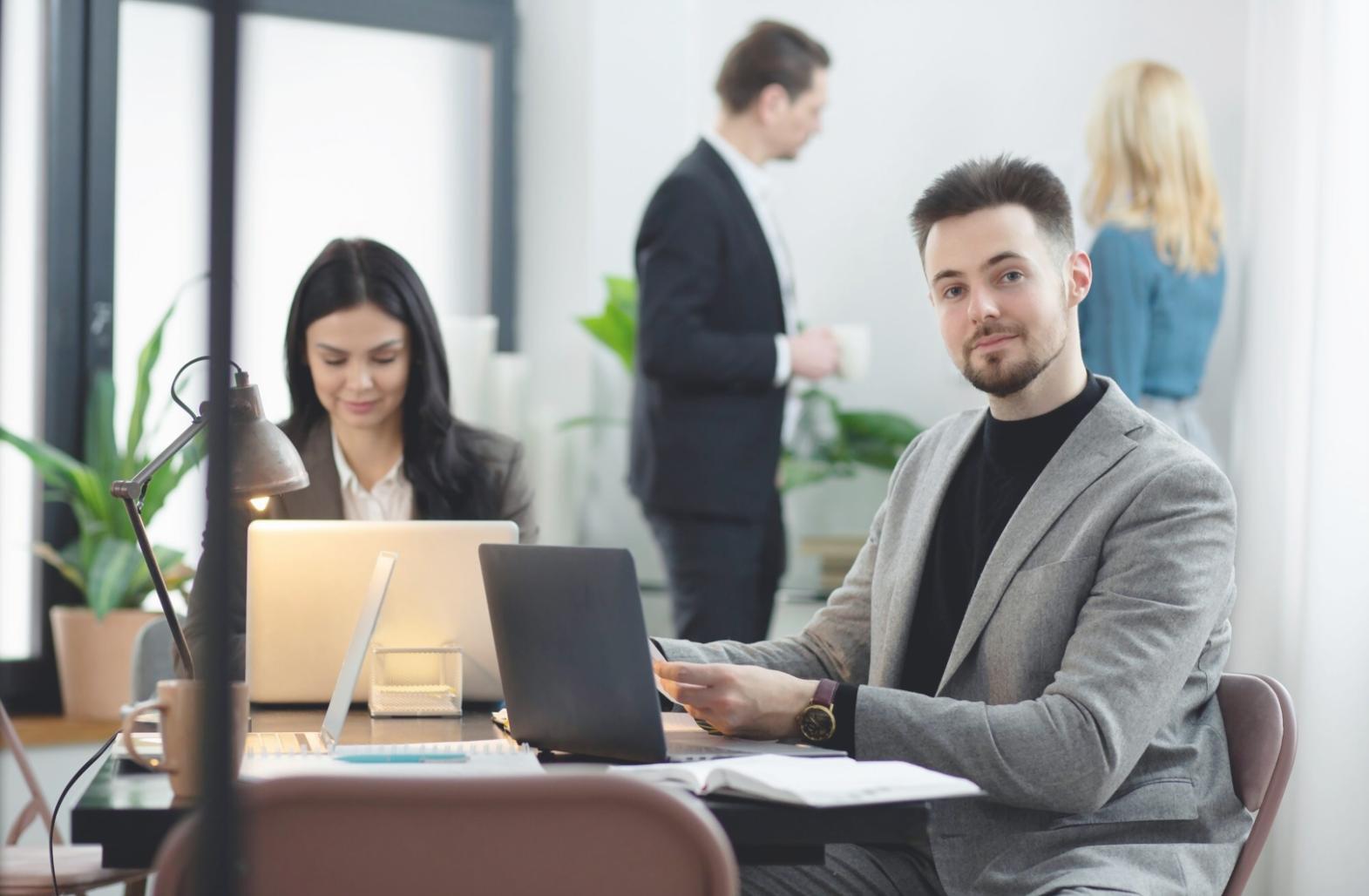 Business professional reviewing automated financial reports and analytics dashboards